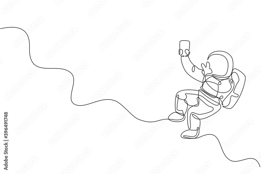 Fototapeta Single continuous line drawing of floating science astronaut in spacewalk pose selfie using smartphone. Fantasy deep space exploration, fiction concept. Trendy one line draw design vector illustration
