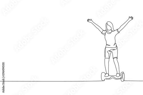 One continuous line drawing of young happy woman stand and ride hoverboard at outdoor park. Green transportation. Future urban lifestyle concept. Dynamic single line draw design vector illustration