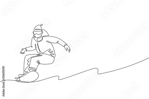 One single line drawing young energetic snowboarder man ride fast snowboard at snowy mountain graphic vector illustration. Tourist vacation lifestyle sport concept. Modern continuous line draw design