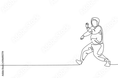 One single line drawing of young modern street dancer man with hoodie performing hip hop dance on the stage vector illustration graphic. Urban generation lifestyle concept. Continuous line draw design