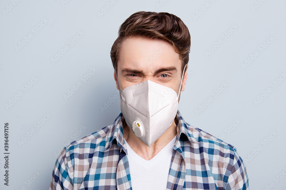 Photo of aggressive man wear checkered shirt healthcare respirator isolated grey color background Photo of aggressive man wear checkered shirt healthcare respirator isolated grey color background