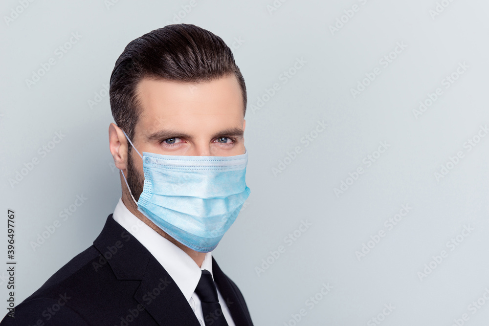 Close up portrait of intelligent person wear safe cold flu respiratory isolated on gray color background Close up portrait of intelligent person wear safe cold flu respiratory isolated on gray color background