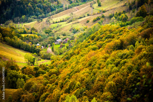 Beautiful green landscape with a village in the Apuseni Mountains, Romania photo