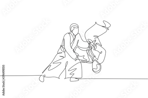 Single continuous line drawing of young sportive man wearing kimono practice throwing enemy in aikido fighting technique. Japanese martial art concept. Trendy one line draw design vector illustration