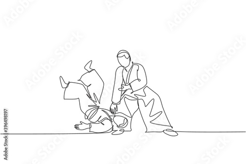Single continuous line drawing of two young sportive men wearing kimono practice throwing in aikido fighting technique. Japanese martial art concept. Trendy one line draw design vector illustration