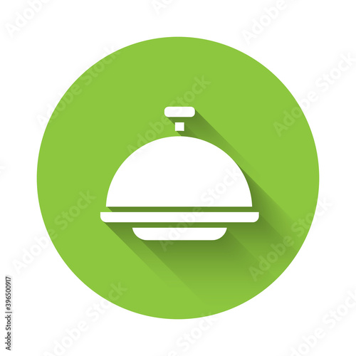 White Covered with a tray of food icon isolated with long shadow. Tray and lid sign. Restaurant cloche with lid. Green circle button. Vector.