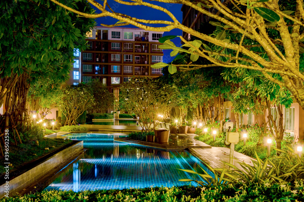 Swimming pool at night time with illumination