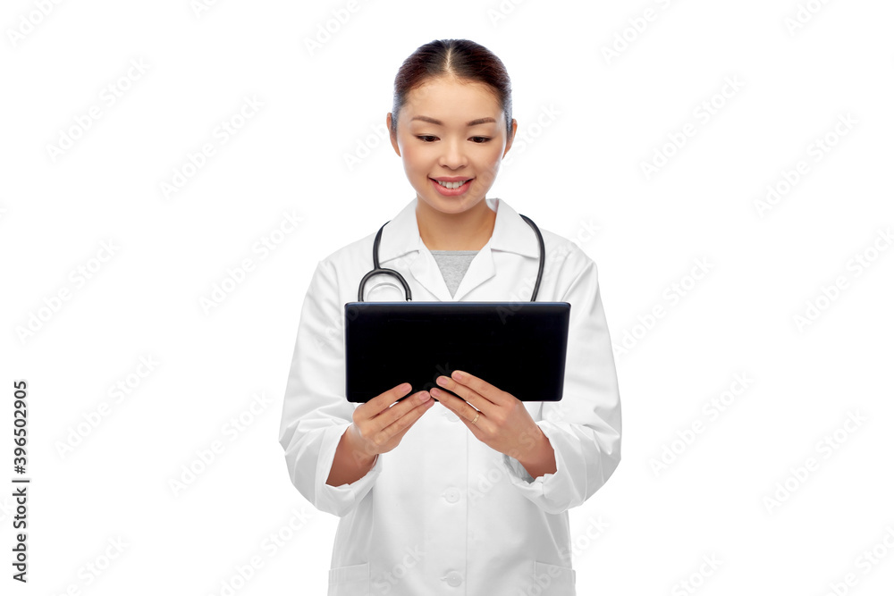 medicine, profession and healthcare concept - happy smiling asian female doctor in white coat with tablet pc computer and stethoscope medicine, profession and healthcare concept - happy smiling asian female doctor in white coat with tablet pc computer and stethoscope