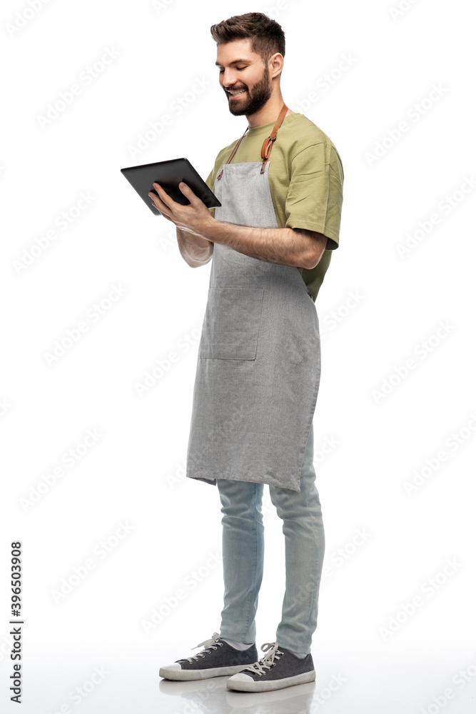 people, profession and job concept - happy smiling waiter or seller in apron with tablet pc computer over white background people, profession and job concept - happy smiling waiter or seller in apron with tablet pc computer over white background