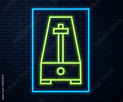 Glowing neon line Classic Metronome with pendulum in motion icon isolated on brick wall background. Equipment of music and beat mechanism. Vector.