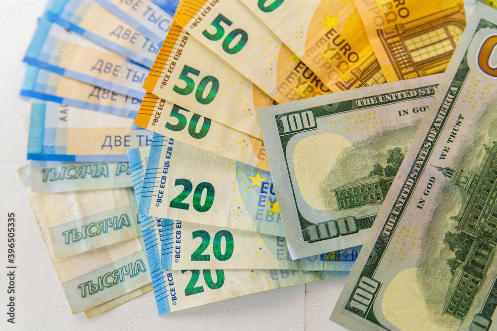Paper notes of Euro, dollar and Russian rubles. Exchange rate. Buy currency sign. Exchange money. Dollar money cash. Investment concept Paper notes of Euro, dollar and Russian rubles. Exchange rate. Buy currency sign. Exchange money. Dollar money cash. Investment concept