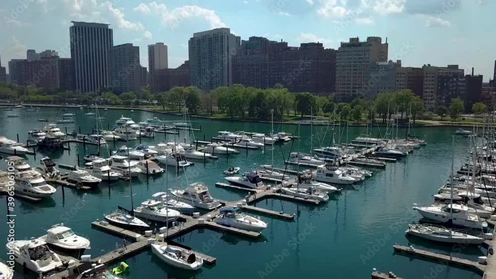 MAIN FOUCS: Drone clip contains motion picture south of Millennium Park in Chicago where curvy walking paths, skiffs, sail boats are abundant.
SECONDARY FOUCS:
Person walking on boardwalk. MAIN FOUCS: Drone clip contains motion picture south of Millennium Park in Chicago where curvy walking paths, skiffs, sail boats are abundant.
SECONDARY FOUCS:
Person walking on boardwalk.