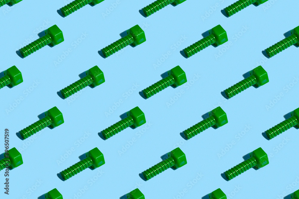 Seamless regular pattern with green bolt on a blue background. Hard light. Father's day holiday concept. Seamless regular pattern with green bolt on a blue background. Hard light. Father's day holiday concept.