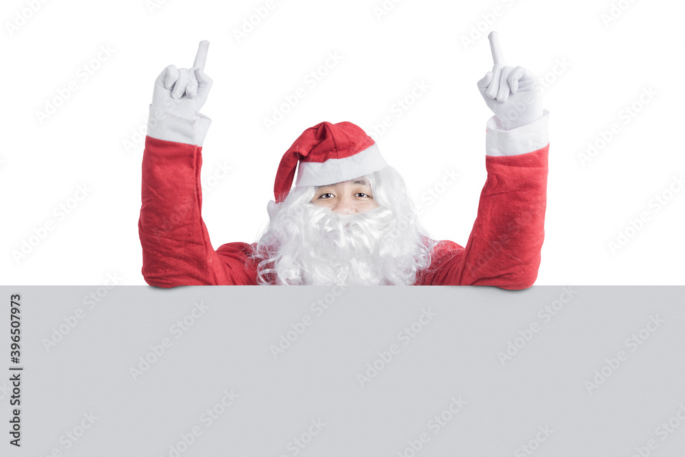 Asian man in Santa costume showing empty board Asian man in Santa costume showing empty board