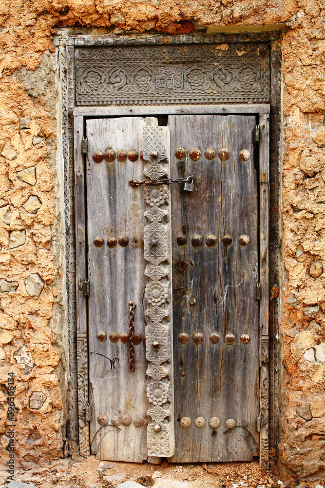 Old decorative wooden door in Stone Town, Zanzibar.