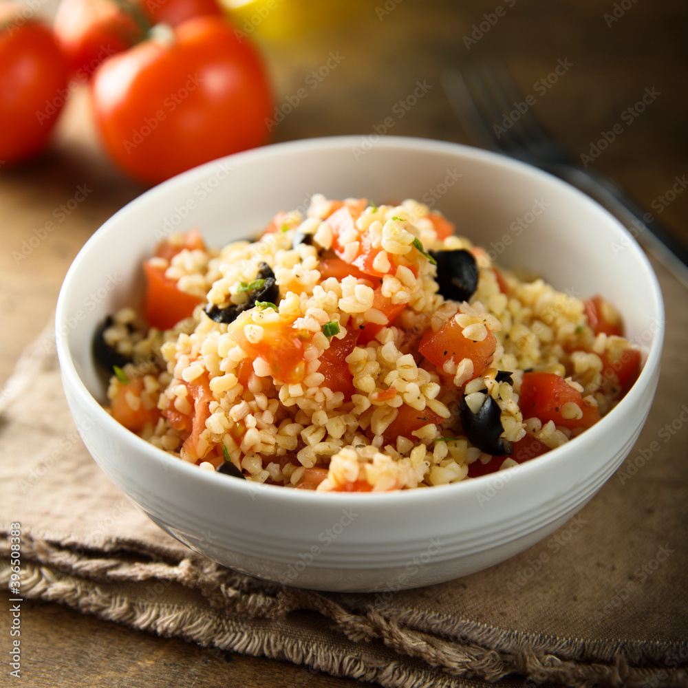 Warm bulgur salad with tomatoes and olives Warm bulgur salad with tomatoes and olives