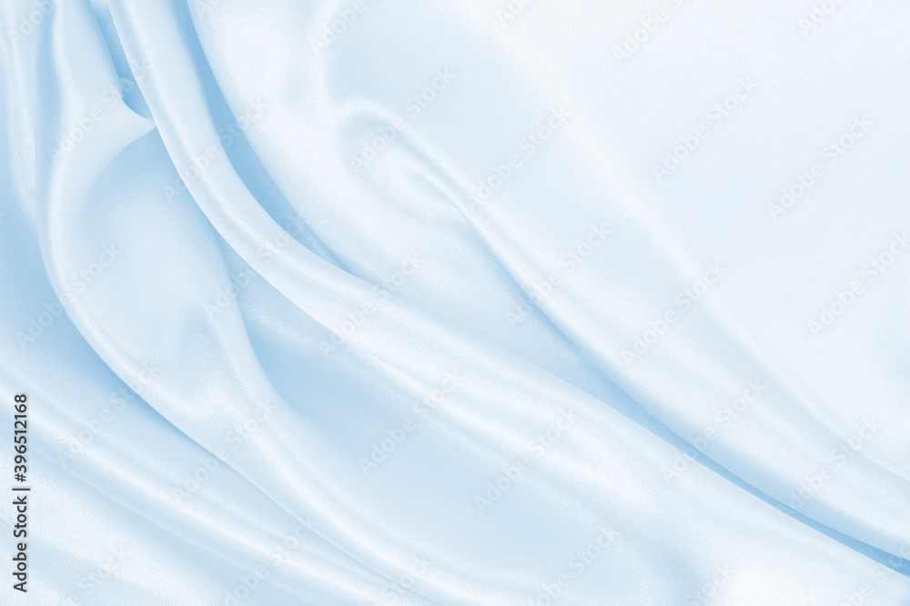Smooth elegant blue silk or satin luxury cloth texture as abstract background. Luxurious background design Smooth elegant blue silk or satin luxury cloth texture as abstract background. Luxurious background design