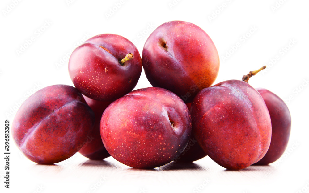 Composition with plums isolated on white background