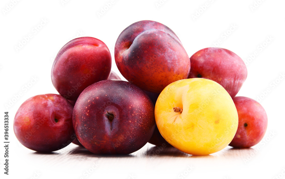 Composition with plums isolated on white background