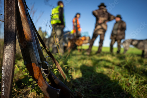 Fotografie, Tablou Rifle in front hunters.