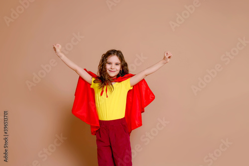фотография Banner little power super hero cute girl kid in a red raincoat