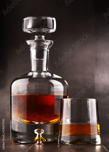 Composition with glass and carafe of hard liquor