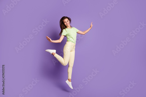 Full length body size view of her she nice attractive lovely cheerful cheery slender thin girl jumping having fun free time dance isolated bright vivid shine vibrant lilac violet color background