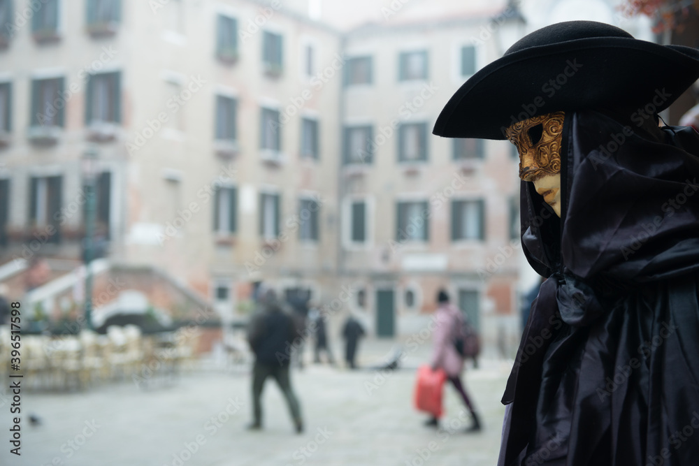 Obraz premium Colorful carnival beautiful masks at a traditional festival in Venice, Italy.