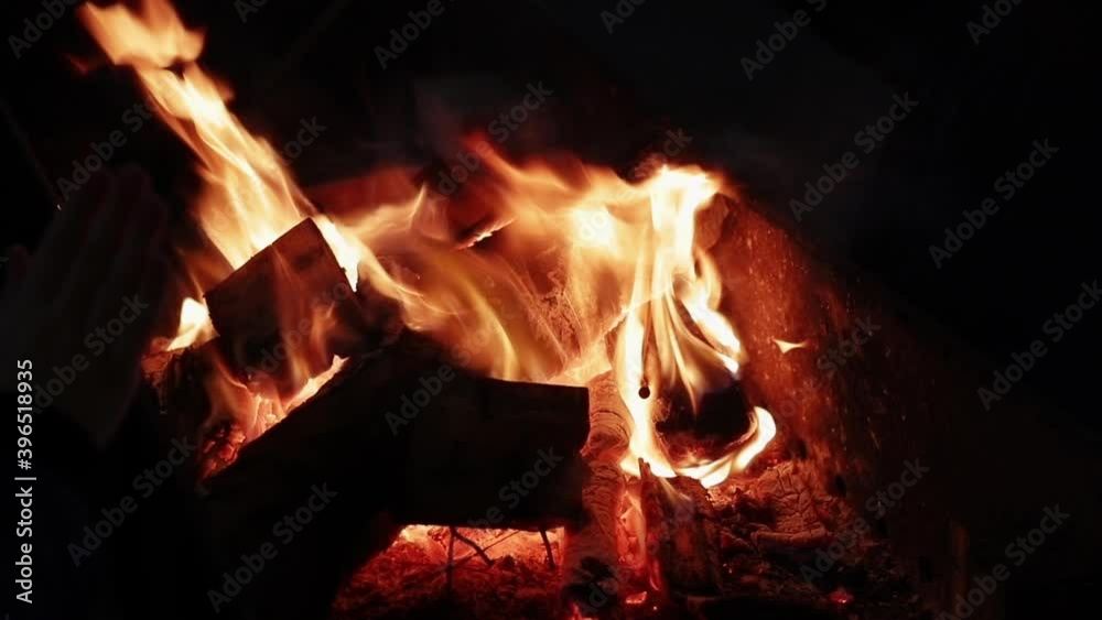 burning firewood at night, red flames and coals close-up
burning firewood at night, red flames and coals close-up