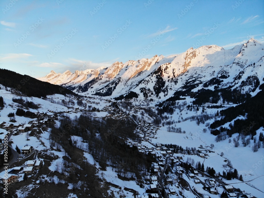 Winter landscape with mountain under evening sky.