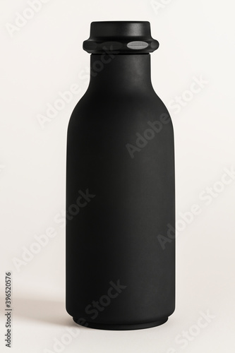 Black water bottle mockup on an off white background