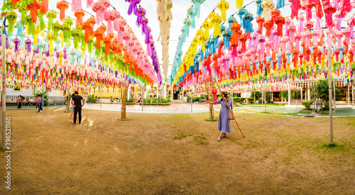 LAMPHUN, THAILAND - October 28, 2020 : Panorama View of Phra That Hariphunchai Pagoda with Beautiful Lantern in Lamphun Lantern Festival photo