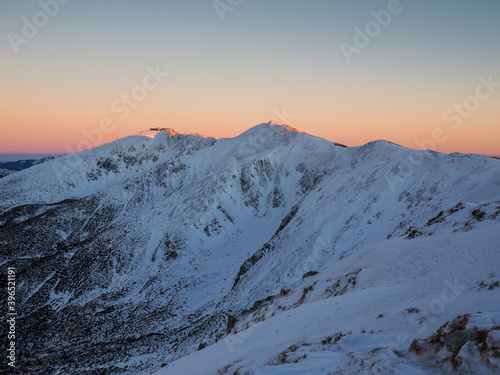Main ridge of the Low Tatras, National park in Slovakia, Chopok, Snow covered mountains during sunset
