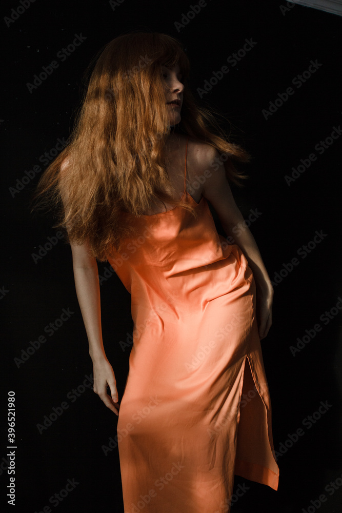 Naklejka premium portrait of a woman with ginger hair and dress