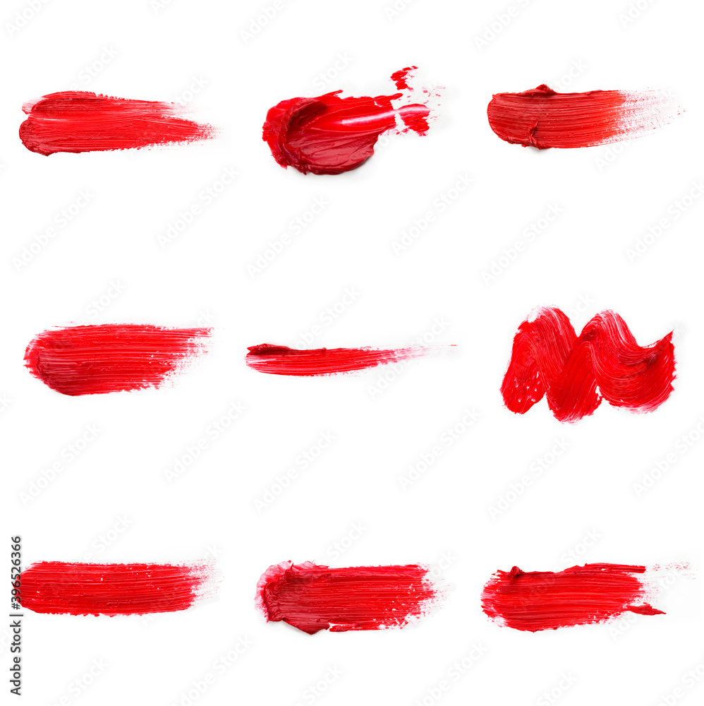 Lipstick smear smudge swatch isolated on white background. Cream makeup texture. Bright red color cosmetic product brush stroke swipe sample