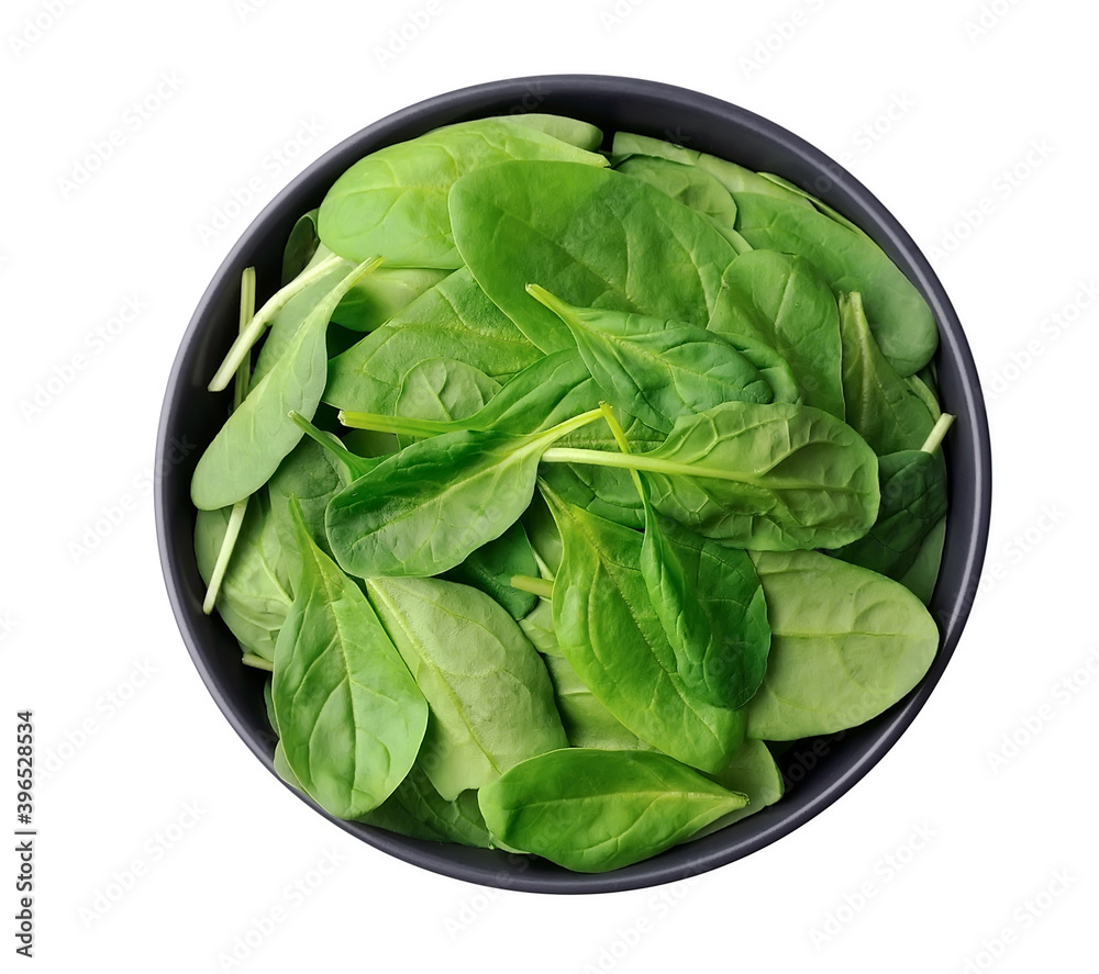 Fresh baby spinach leaves on plate isolated Fresh baby spinach leaves on plate isolated