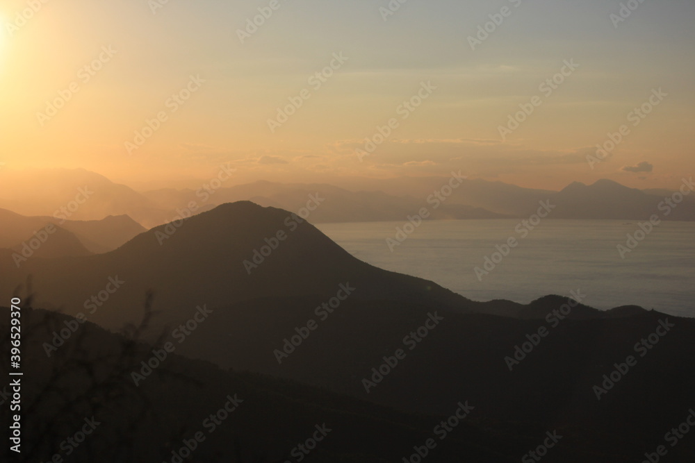 sunset in mountains and sea 