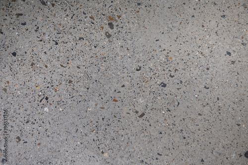Ground Concrete floor inside building with polished gravels.
