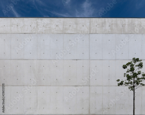 A fine fair faced concrete wall with dark blue sky.