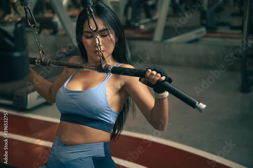 fitness woman with training machine in gym © chachamp