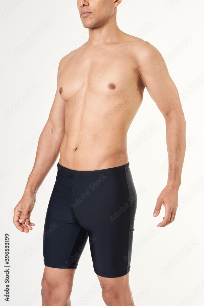 Fototapeta premium Man wearing black swim jammers mockup