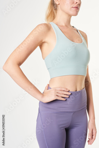 Fotografie Blonde woman in a sports bra mockup