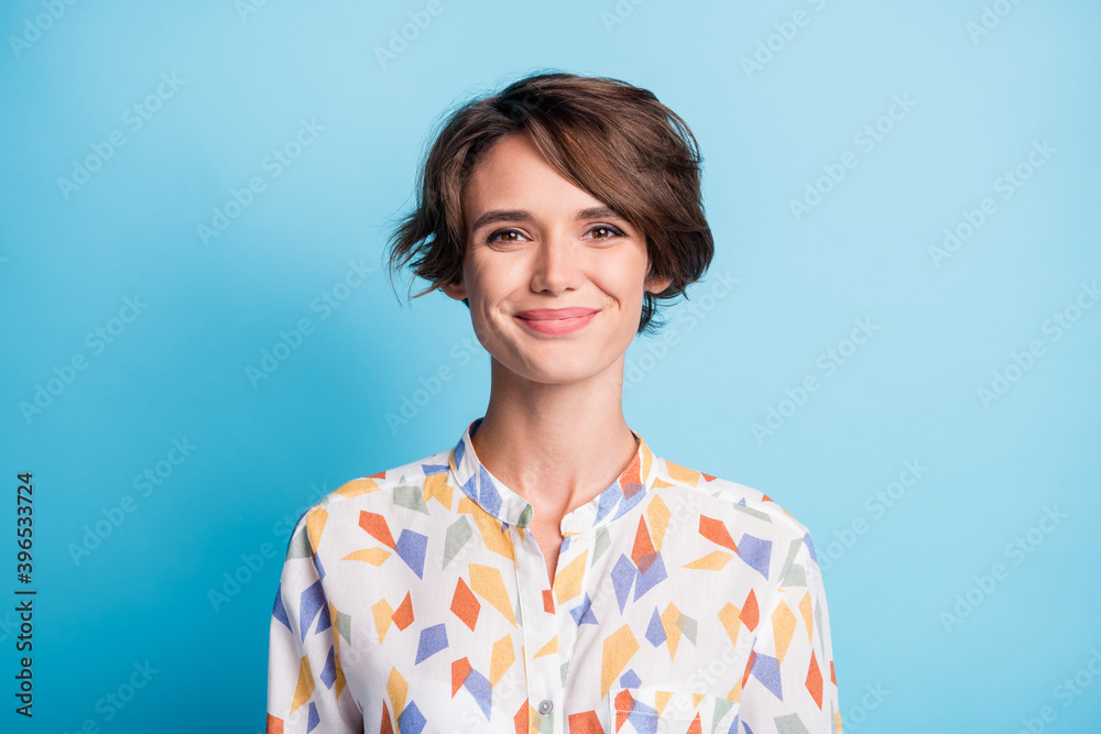 Photo of happy cheerful attractive young woman wear white print shirt isolated on pastel blue color background Photo of happy cheerful attractive young woman wear white print shirt isolated on pastel blue color background