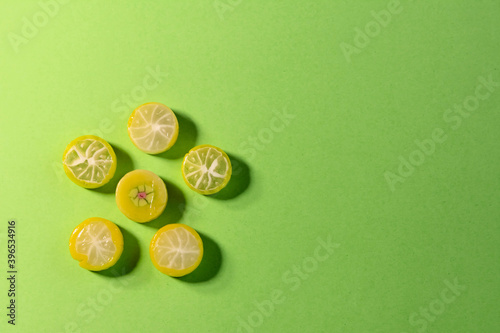 colored candies on a green background