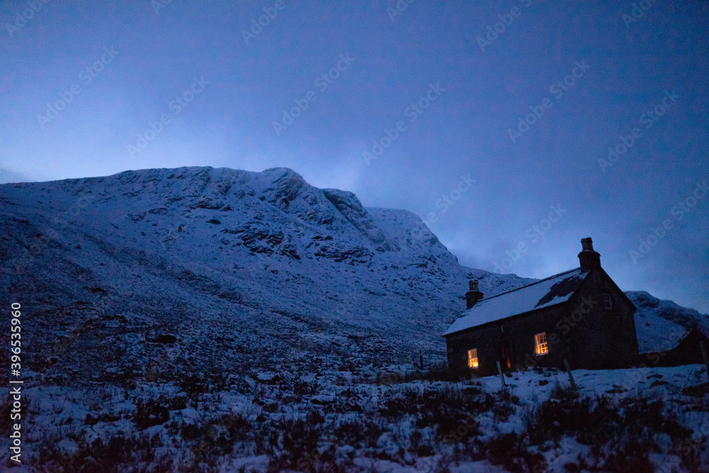 House covered with snow on a misty day House covered with snow on a misty day