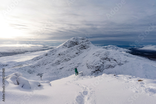 Female photographer on a snowy mountain