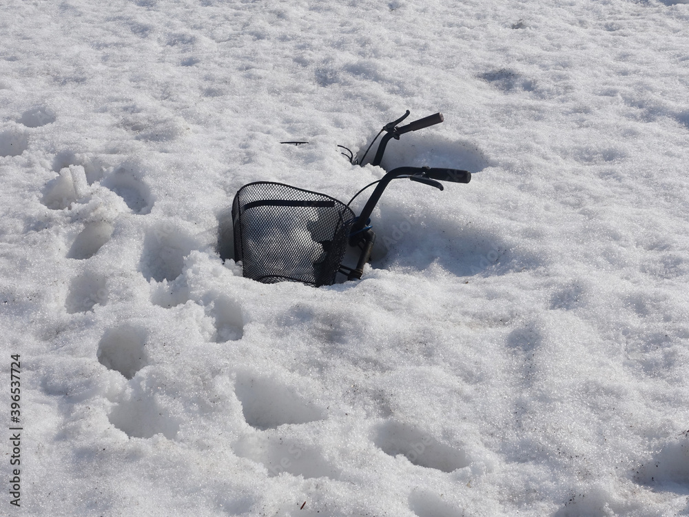 Naklejka premium A bicycle covered with fresh snow in Hokkaido after Snowstorm.