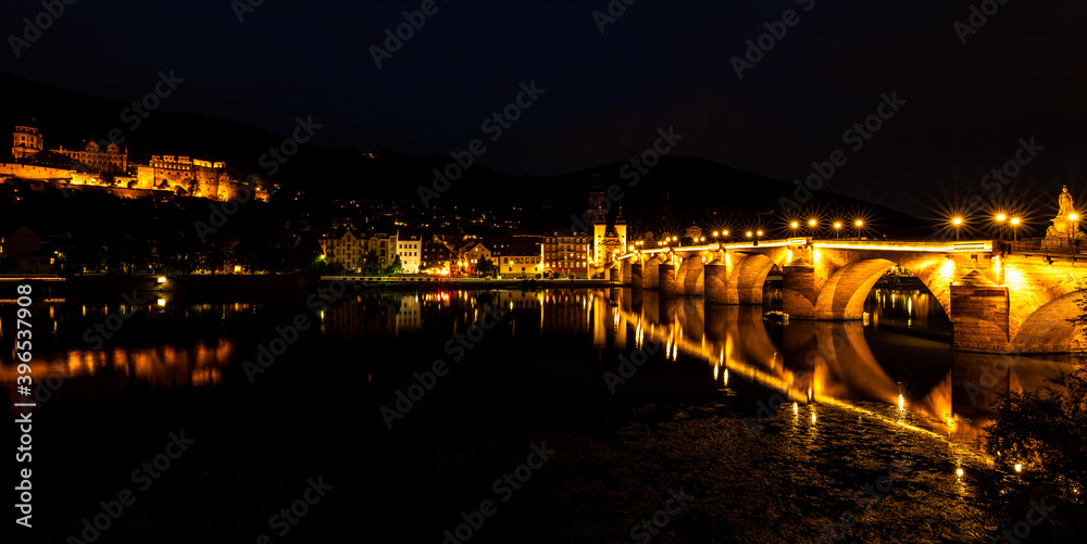 Romantic town of Heidelberg with castle and old bridge at night, Baden-Württemberg, Germany.