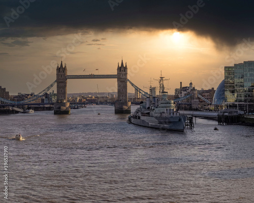 London England, the tower bridge over Thames river under dramatic sky