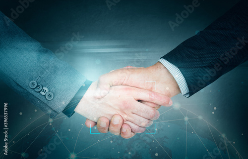 Business people shaking hands for a deal photo